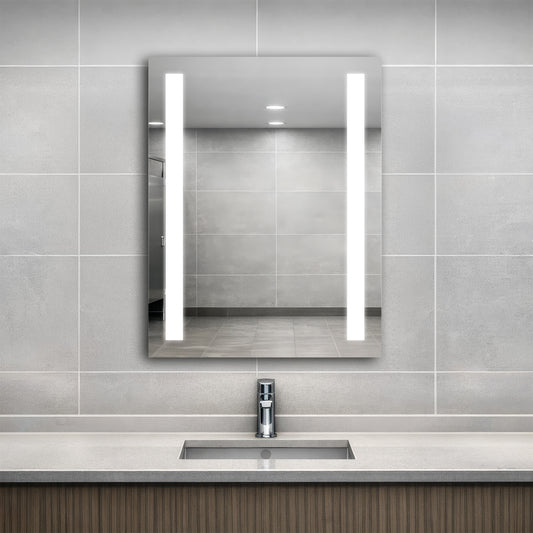 Bathroom with a modern sink and Ledge lighted mirror on a tiled wall.