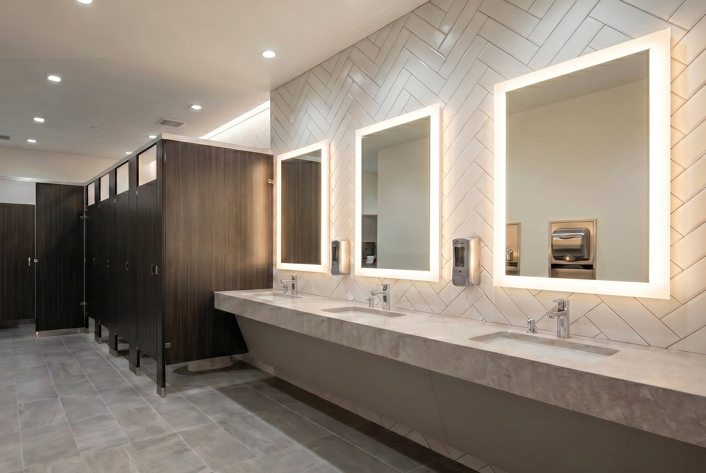 Three Facet Lighted mirrors in a modern bathroom