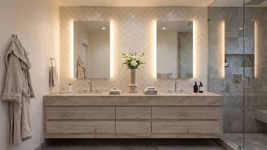 Two Séura Veil lighted mirrors installed above a vanity in a luxury hotel bathroom
