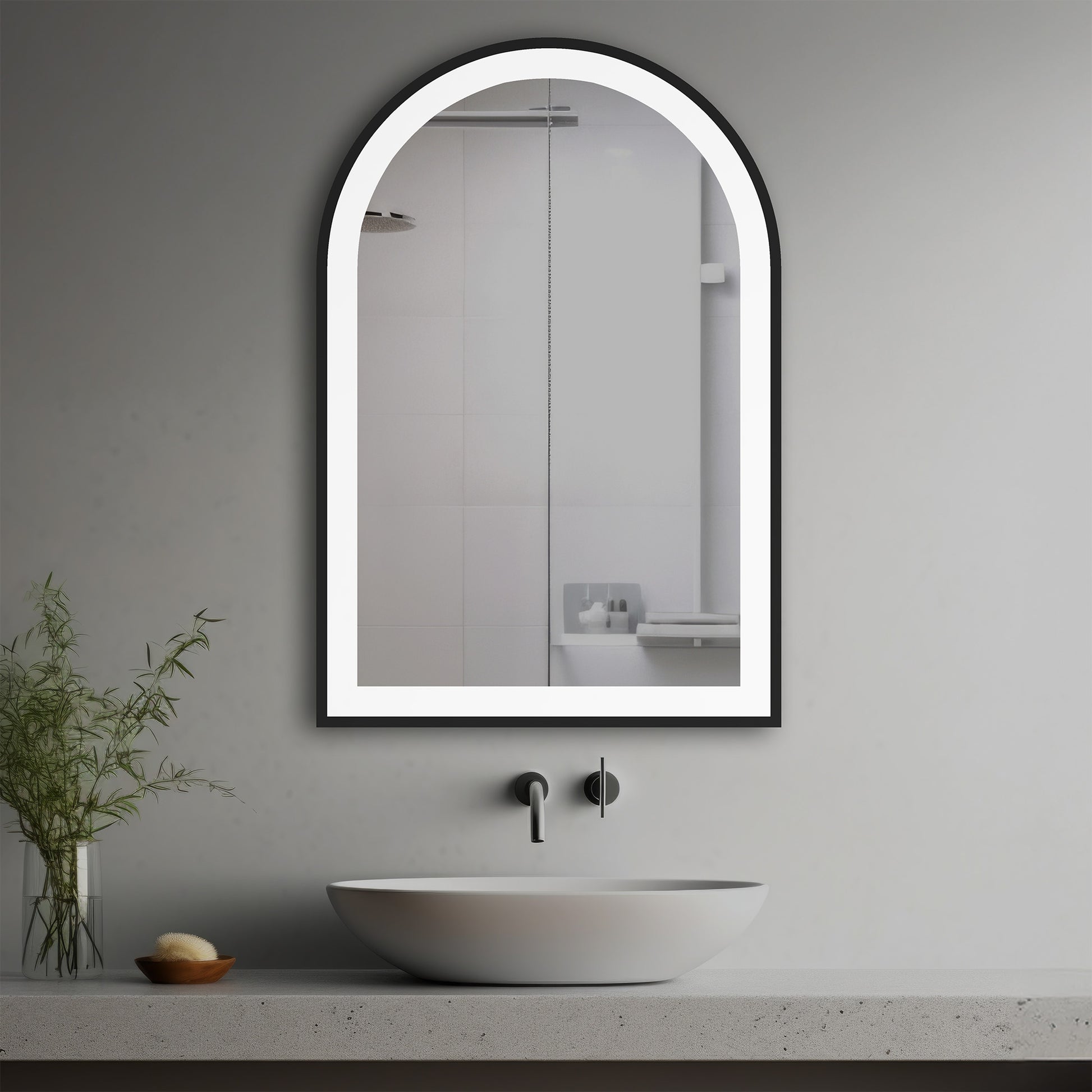 Dusk Lighted Mirror in a modern bathroom over a vessel sink