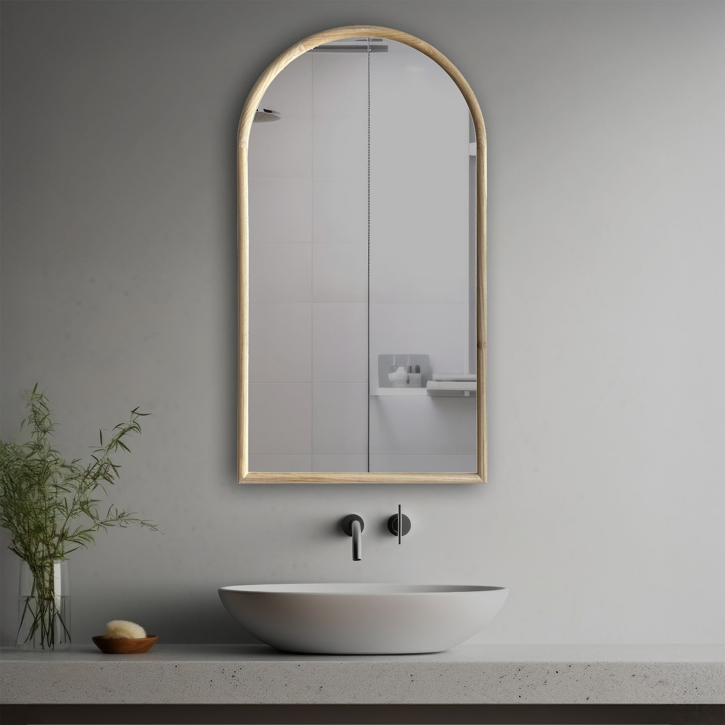 Vela Decorative Mirror in a modern bathroom over a vessel sink