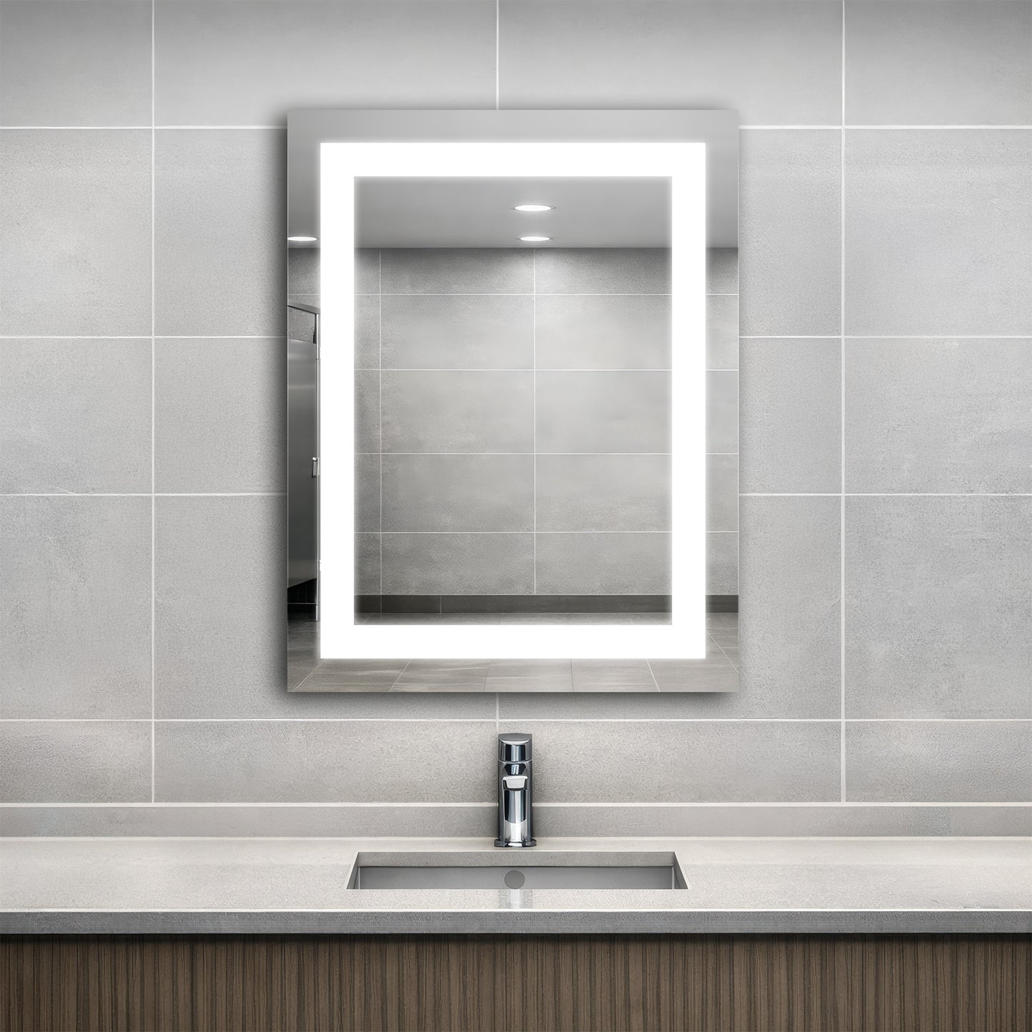 Bathroom with an Align lighted mirror above a sink against a tiled wall.