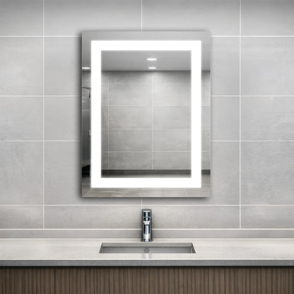 Bathroom with an Align lighted mirror above a sink against a tiled wall.
