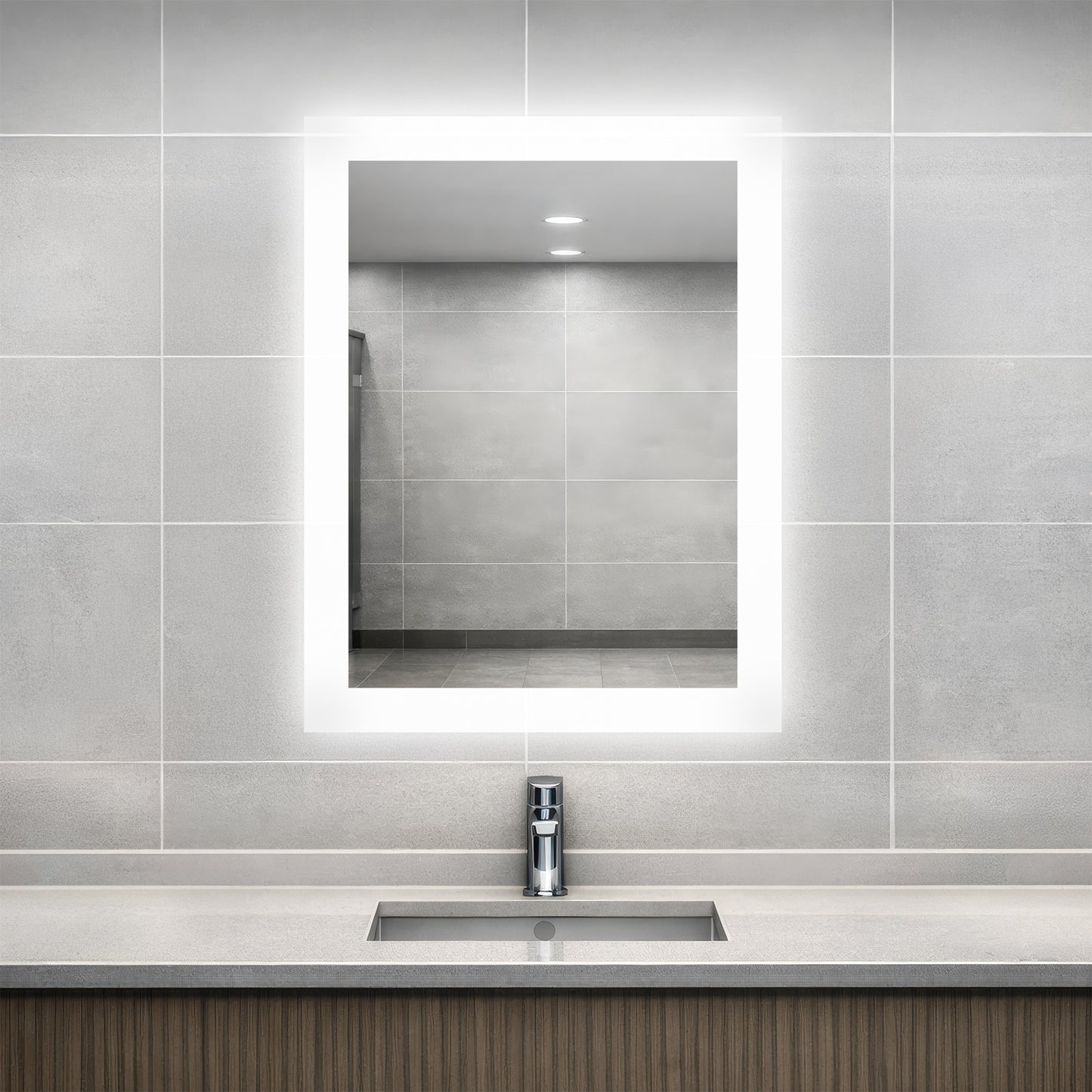 Bathroom vanity with Facet lighted mirror and sink.