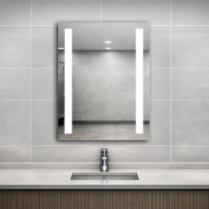 Bathroom with a modern sink and Ledge lighted mirror on a tiled wall.