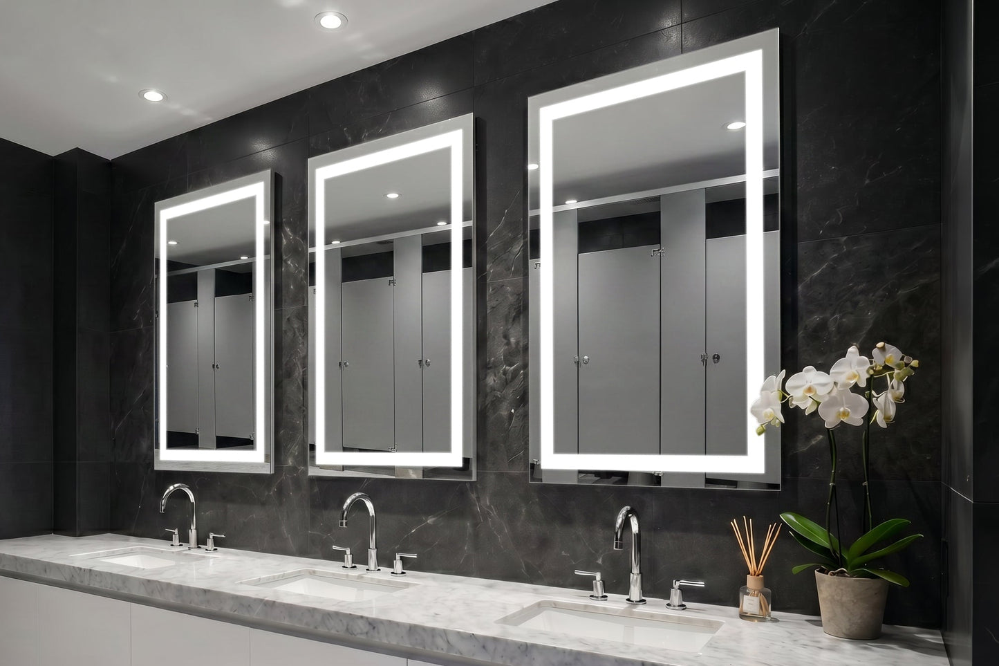 Bathroom with three Align lighted mirrors above a vanity.