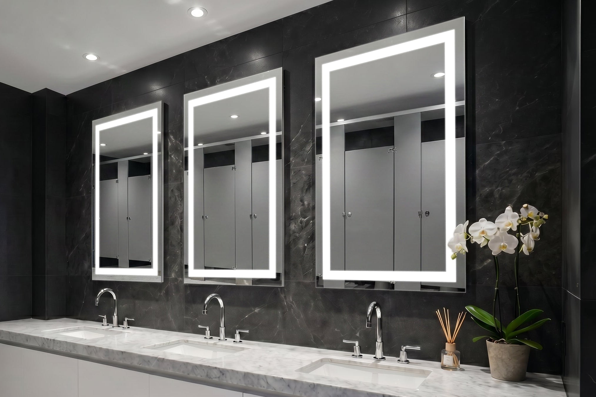 Bathroom with three Align lighted mirrors above a vanity.