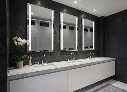 Bathroom with three Ledge lighted mirrors above a vanity.